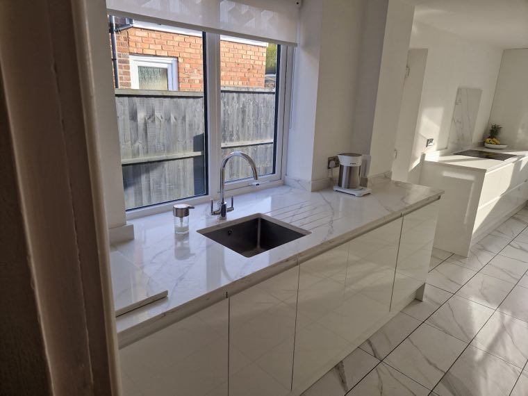 Dark green fitted kitchen