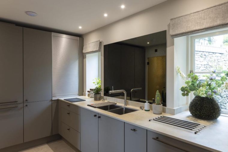 Kitchen sink run with mirrored splashback