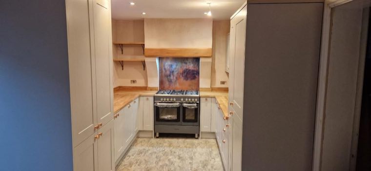 Bespoke oak canopy over a range cooker