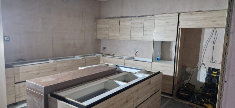 Kitchen units being fitted